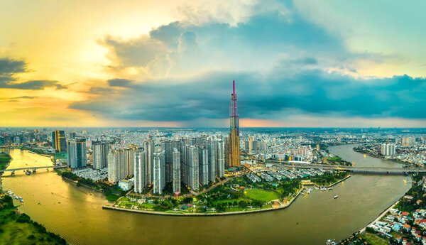 Top view aerial of center Ho Chi Minh city, Vietnam, beauty skyscrapers along river urban development, transportation, energy power infrastructure. Financial, travel and business concept.