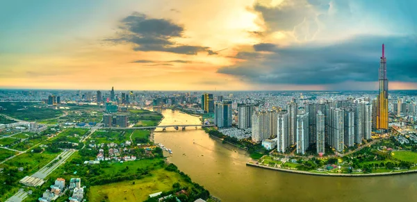 stock image Top view aerial of center Ho Chi Minh city, Vietnam, beauty skyscrapers along river urban development, transportation, energy power infrastructure. Financial, travel and business concept.