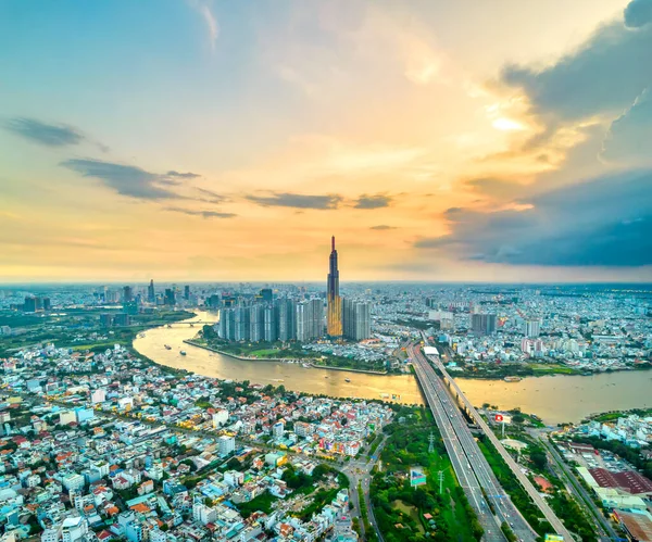 stock image Top view aerial of center Ho Chi Minh city, Vietnam, beauty skyscrapers along river urban development, transportation, energy power infrastructure. Financial, travel and business concept.