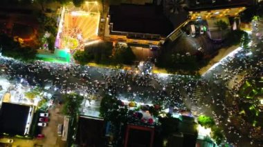 Aerial view of Da Lat city night beautiful tourism destination in central highlands Vietnam. Urban development texture, green parks and city lake.