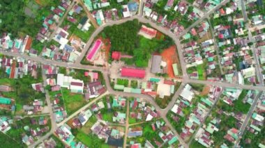Residential area in Bao Loc city, Vietnam seen from above with the center being the church and the streets divided like abstract Chinese bagua