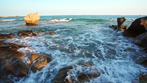 Waves Crashing Shore Creating Silk Streaks Different Shapes Piercing Rock — Stockvideo