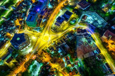 Aerial view of Da Lat city night beautiful tourism destination in central highlands Vietnam. Urban development texture, green parks and city lake.