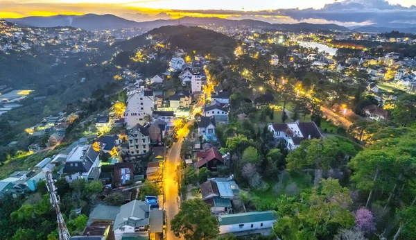 stock image Aerial view of Da Lat city night beautiful tourism destination in central highlands Vietnam. Urban development texture, green parks and city lake.