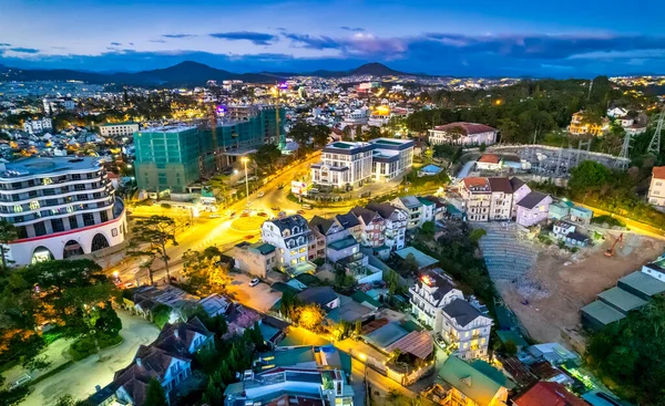 stock image Aerial view of Da Lat city night beautiful tourism destination in central highlands Vietnam. Urban development texture, green parks and city lake.