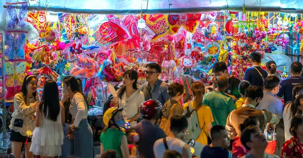 stock image Ho Chi Minh city, Vietnam - 20 August 2022: People come to the street of lanterns to shopping and take photos for the mid-autumn festival in Cho Lon, Chinatown, Vietnam