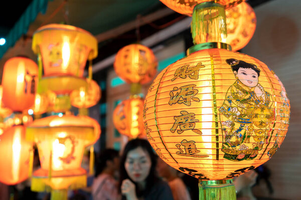 Ho Chi Minh city, Vietnam - 20 August 2022: People come to the street of lanterns to shopping and take photos for the mid-autumn festival in Cho Lon, Chinatown, Vietnam