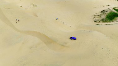 Mui Ne, Vietnam yakınlarındaki kum ve su arasında katı bir coğrafi zıtlık var. Vietnam 'ın Mui Ne Çölü, Güneydoğu Asya' da bir çöldür.