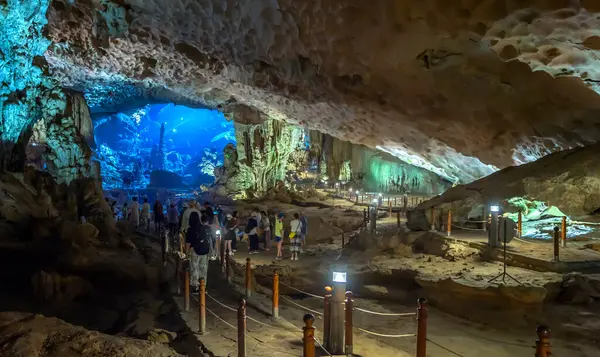 stock image Halong bay, Vietnam - April 3rd, 2024: Tourist travel in Sung Sot cave is one of the best and is located in the UNESCO World Heritage in Halong bay, Vietnam