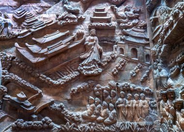 Ninh Binh, Vietnam - April 5th, 2024: Stone carved base-relief of Ky Lan temple. Human figures and floral ornament bas-relief. Traditional Champa architectural details. clipart