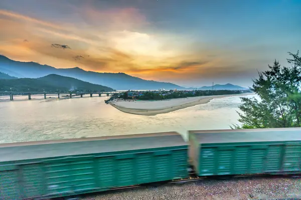 stock image Hue, Vietnam - April 15th, 2024: Lang Co bay in the sunset with a small fishing village completely below. This place was voted the most beautiful bay in the world in Hue, Vietnam