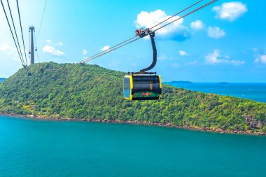 Phu Quoc, Vietnam - April 21st 2024: View of longest cable car ride in the world, Phu Quoc island, Vietnam. Below is seascape with tropical islands and boats. clipart