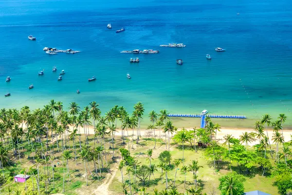 stock image Phu Quoc, Vietnam - April 21st 2024: Nice beach in Phu Quoc island. The bay with blue water, coconut trees, and fine sand is considered a beautiful beach in the Gulf of Thailand