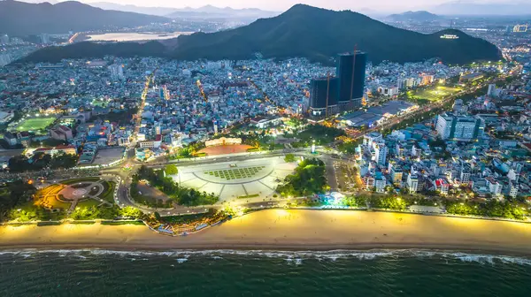 stock image Quy Nhon, Vietnam - April 18th, 2024: The coastal city of Quy Nhon seen from above at night with its beautiful city and clean sandy beach attracts tourists to visit in Quy Nhon, Vietnam