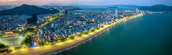 stock image Quy Nhon, Vietnam - April 18th, 2024: The coastal city of Quy Nhon seen from above at night with its beautiful city and clean sandy beach attracts tourists to visit in Quy Nhon, Vietnam