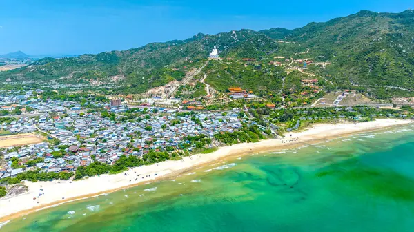 stock image Aerial view of landscape of a fishing village and traditional fishing boat on the beach in Binh Dinh Province, Vietnam.