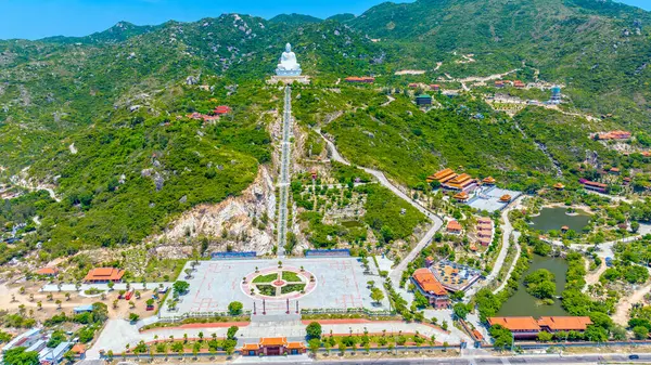 stock image Aerial view of giant Buddha Statue on top of the mountain overlooking the sea Central Vietnam as pray good weather, smooth sea for fishermen fishing easier