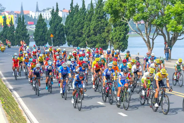 Stock image Da Lat, Vietnam - April 24th, 2024: Amazing cycle race, sport activity to celebrate national reunification, rider wearing helmet, ride bicycle in high speed, spirit, Vietnamese rider in action