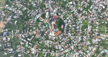 Residential area in Bao Loc city, Vietnam seen from above with the center being the church and the streets divided like abstract Chinese bagua