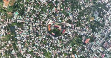 Residential area in Bao Loc city, Vietnam seen from above with the center being the church and the streets divided like abstract Chinese bagua