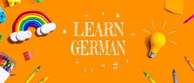 Learn German theme with school supplies overhead view - flat lay