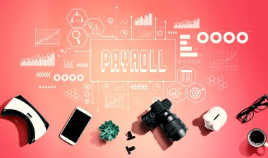 Payroll theme with electronic gadgets and office supplies - flat lay