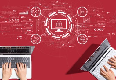 Fintech theme with people working together with laptop computers