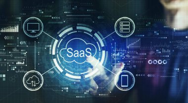 SaaS - genç bir adamın geceleri dijital ekrana dokunduğu bir hizmet konsepti olarak yazılım