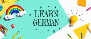 Learn German theme with school supplies overhead view - flat lay
