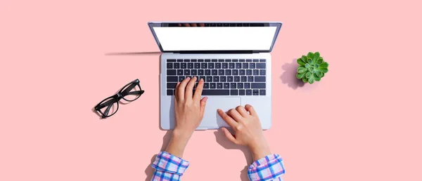 stock image Person using a laptop computer from above