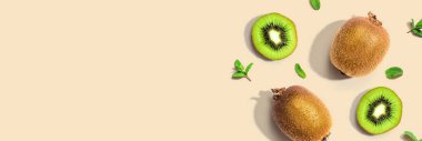 Fresh green kiwis overhead view - flat lay