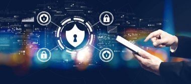 Cyber security theme with businessman using a tablet computer at night