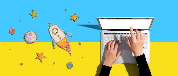 Space exploration theme with a rocket and a laptop