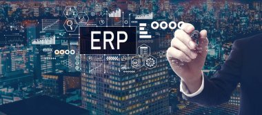 ERP - Enterprise resource planning theme with businessman in a city at night