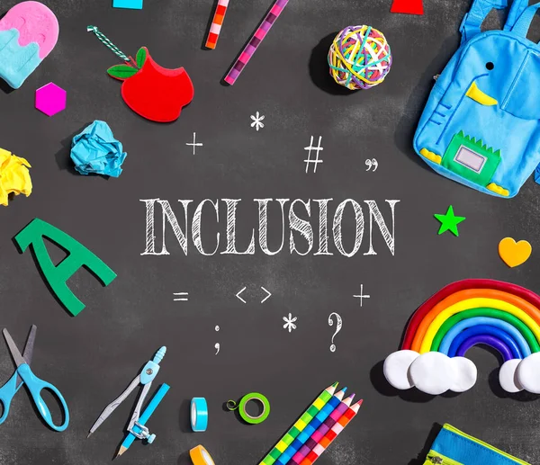 Inclusion Theme with school supplies on a chalkboard - flat lay