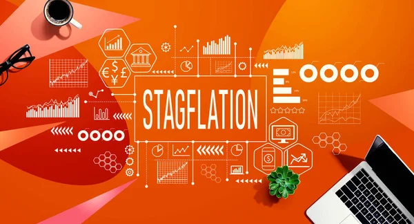 Stagflation theme with a laptop computer on a orange pattern background
