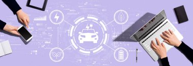 EV concept with two people working together