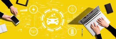 EV concept with two people working together