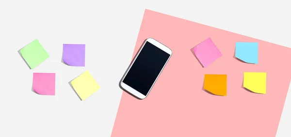 Smartphone Met Veel Kleurrijke Plakkerige Notities Bureau Plat Lay — Stockfoto