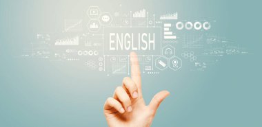 Teknoloji ekranındaki bir düğmeye elle basarak İngilizce kavramı öğrenmek