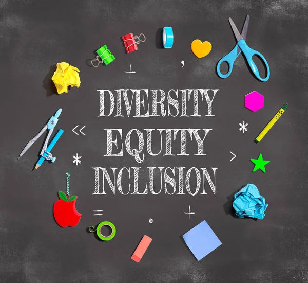 Diversity, Equity and Inclusion theme with school supplies on a chalkboard - flat lay