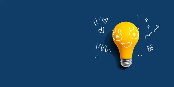 Yellow Light Bulb Happy Face Flat Lay Stock Picture
