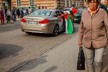 KRISTIANSTAD, SWEDEN - MAY 14, 2021: Palestine flag waved out from car during protest against Israels newly planned attacks on Gaza