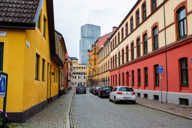 Colorful houses on Gamla Vaster area with view over Malmo Live, Malmo, Sweden clipart