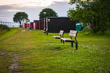 Benches in front of the Oresund bridge in Malmo, Sweden clipart