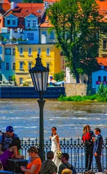 stock image PRAGUE, CZECK REPUBLIC, 5 JUNE 2010: Wedding in front of river Hradcany in Prague, Czech Republic