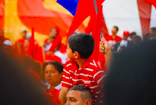 stock image CARACAS, VENEZUELA, February 13, 2009: Boy in audience at election rally for late president Hugo Chavez