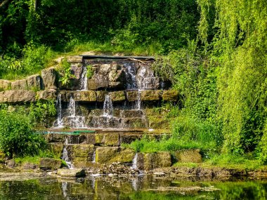 Waterfall in Hanley Park in Stoke-on-Trent, UK clipart