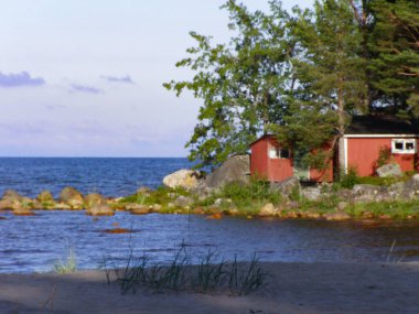 Classic red cabin on the countryside in Norrfjarden, Halsingland, Sweden clipart