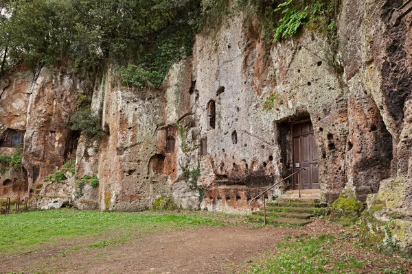 Sutri, Viterbo, Lazio, Italy: facade of the Mitreo, ancient rock-cut church of the Madonna del Parto, developed out of a mithraeum, pagan cult site, in Etruscan archaeological site